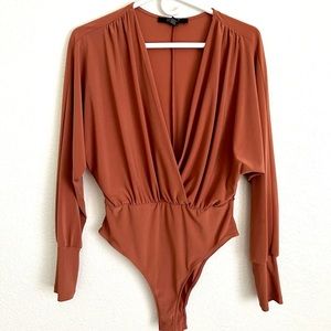 Forever 21 orange bodysuit. Only worn once!